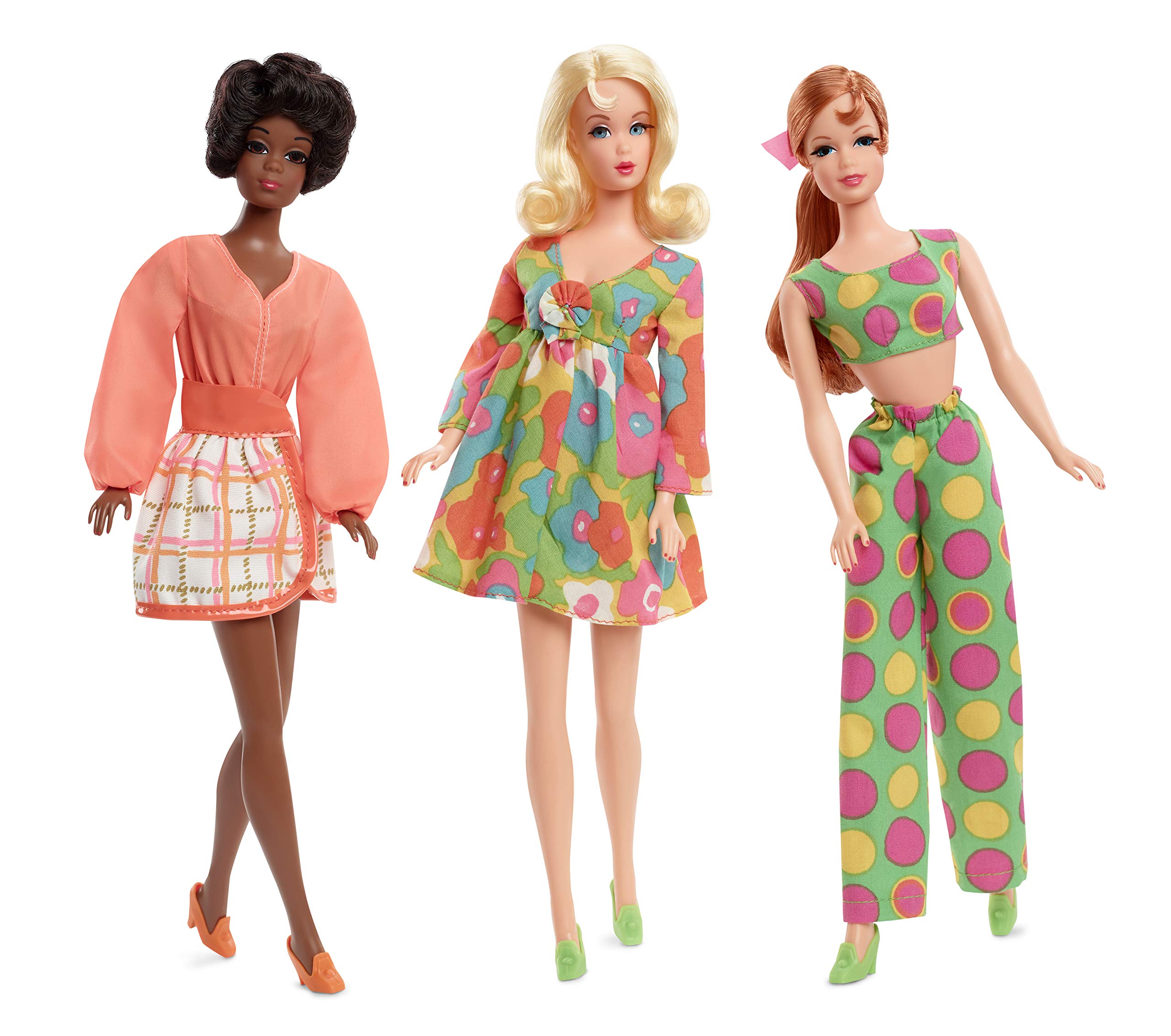 Dolls Christie, Barbie, and Stacie stand together in orange, green, and pink 1970s attire